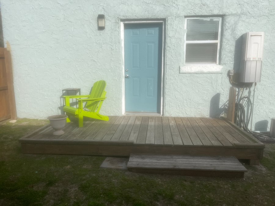 Deck right out your back door into a totally fenced shared yard 