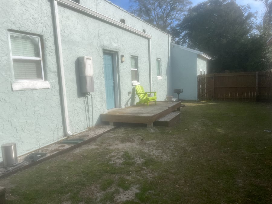 Your deck and chair in a shared fenced yard.  The Bar BQ grill is also shared and a great way to meet your neighbors!