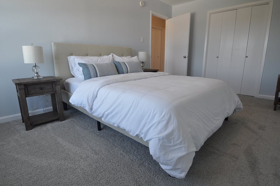 Queen bed in master bedroom. This bedroom has a huge walk in closet and a view of the lake.