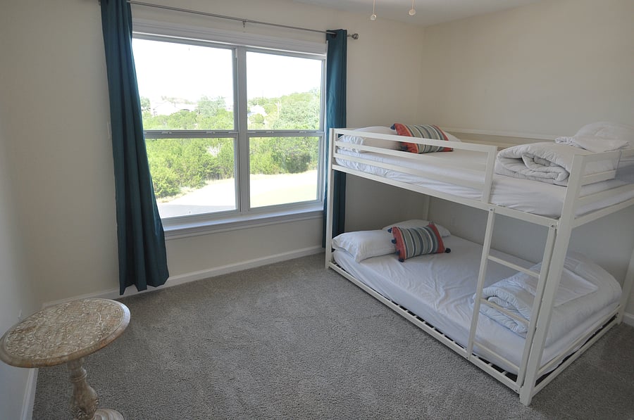 Secondary bedroom with double on bottom and twin on top for bunk beds.