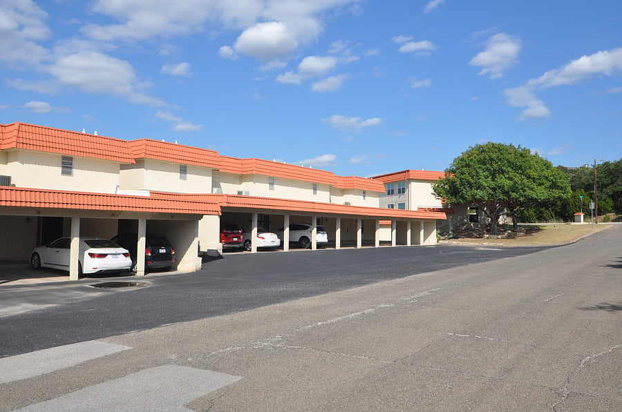 Front exterior. You can see the covered carport parking here. 2 spots are included with the unit.