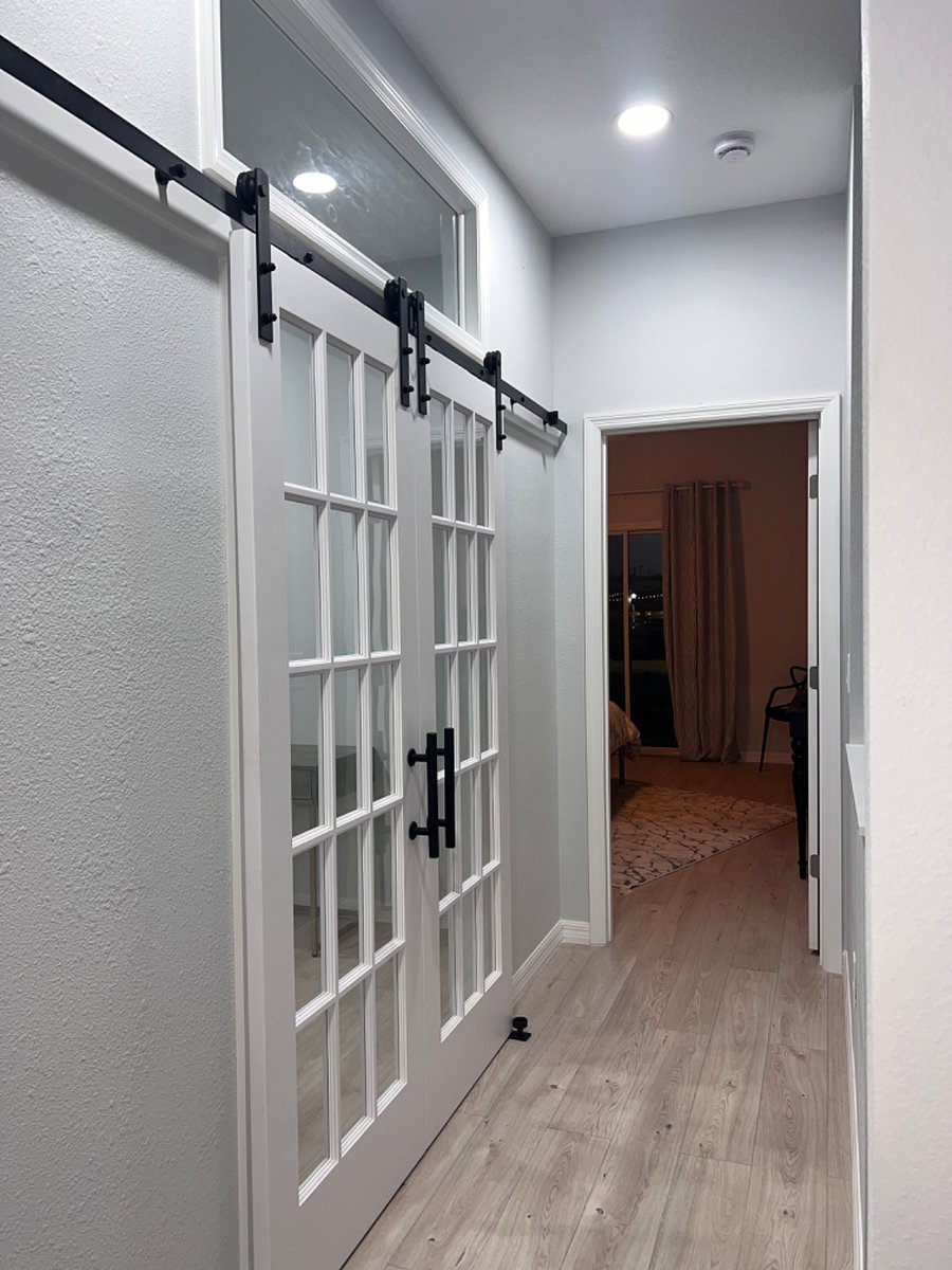 Hallway with designated office and daybed