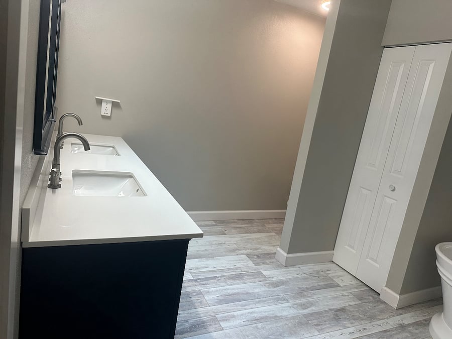 Primary Bathroom-double sink/beautiful blue cabinets