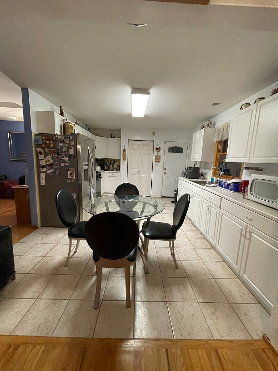 Full kitchen with breakfast area. Back door leads to back patio