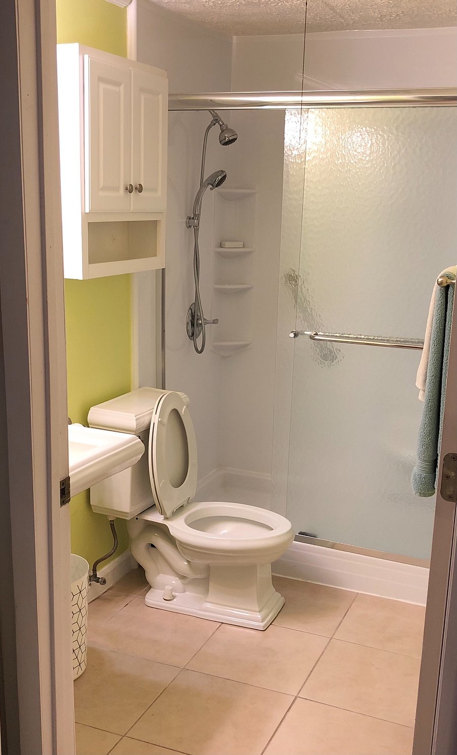 Luxurious walk in shower with bench and wand