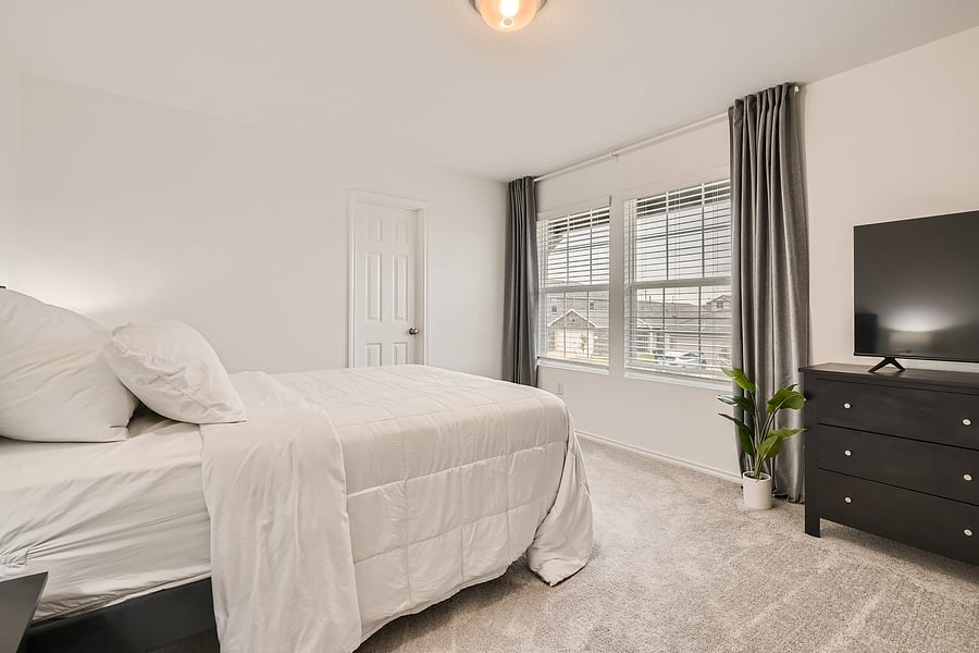 Queen Bedroom upstairs with blackout curtains