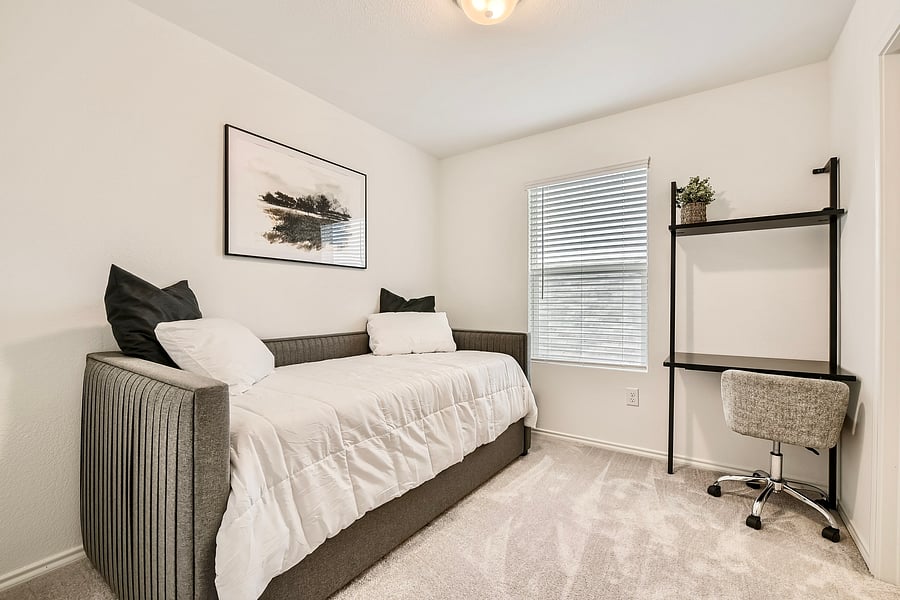 Upstairs bedroom with a trundle bed, two twin mattresses in total. Blackout shades have been added to the room.