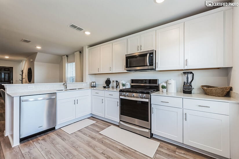 Stainless steel appliances including a refrigerator with ice maker