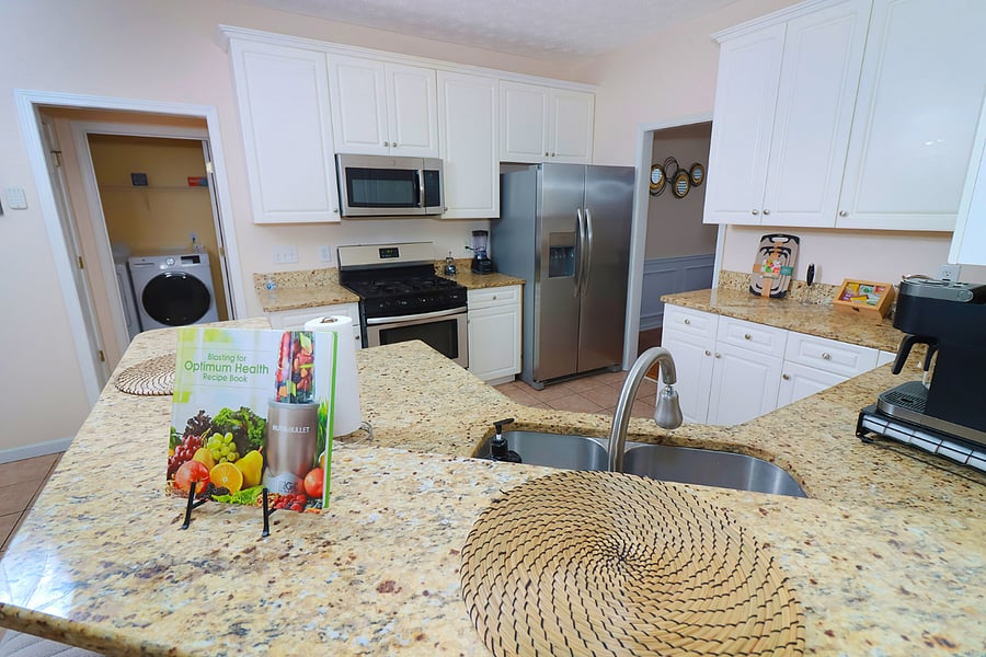 Fully equipped kitchen with modern appliances and ample space for cooking and entertaining.