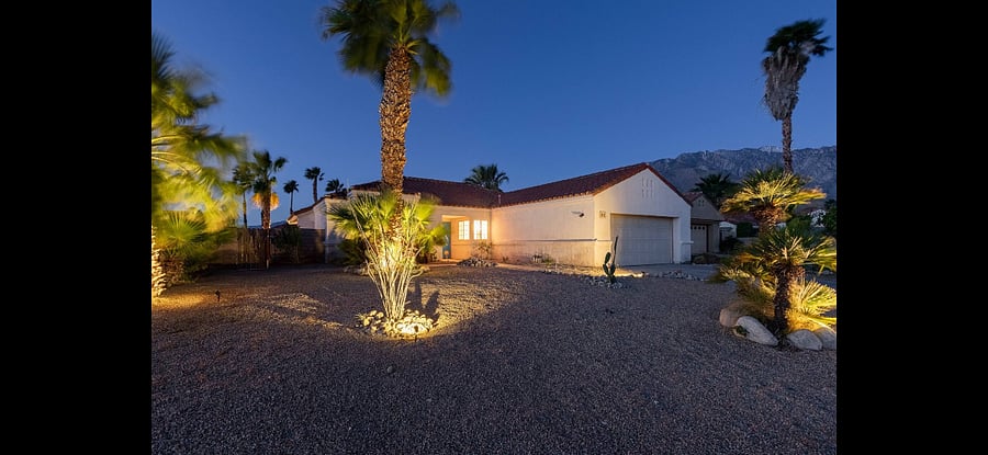 Front yard with outdoor lighting.
