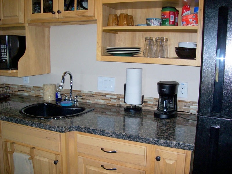 Microwave, refrigerator with cross top freezer