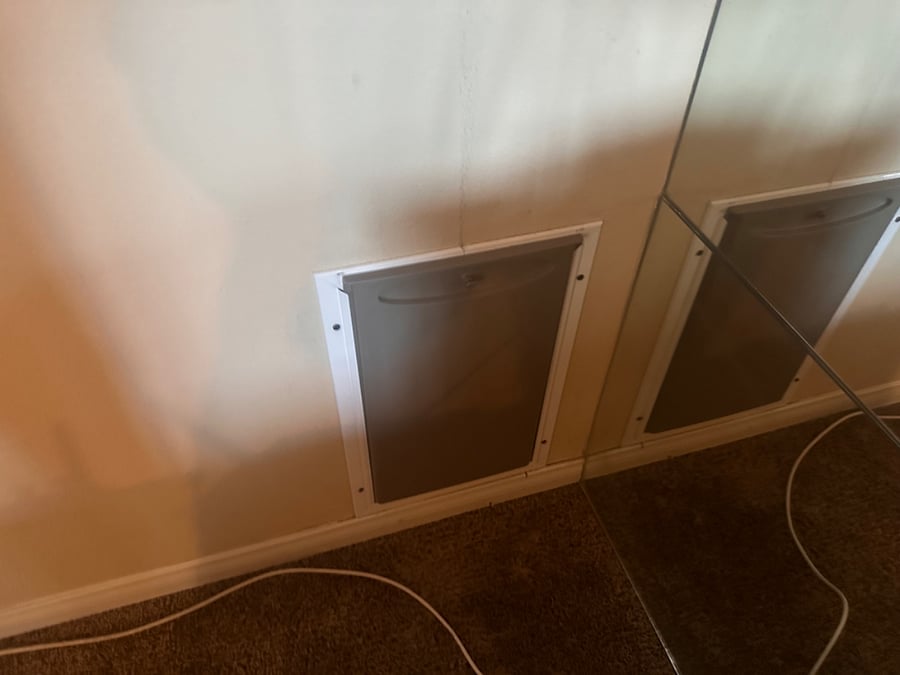 Large Doggy door that leads out to secure dog run. Were re-rocking dog run. 