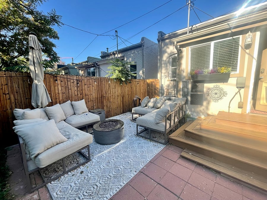 Backyard: Soak up some sun in the backyard as you lounge on the outdoor sectional. Cook on the propane barbeque grill and have dinner by the propane firepit. Enjoy the ambiance after dark by plugging in the outdoor hanging lights that line the fence.