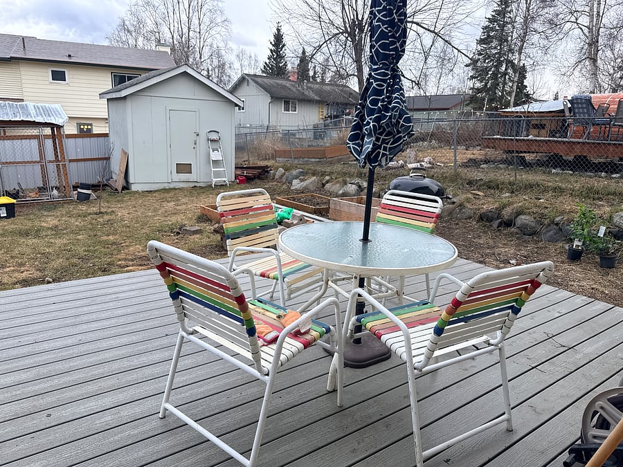 Back deck with outdoor seating (table
Is put away in winter) and mountain views