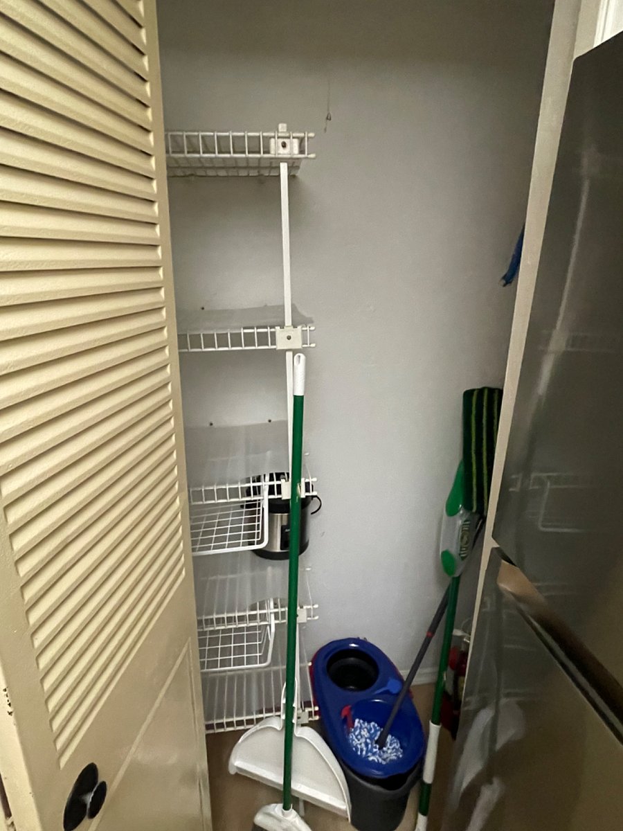 Pantry with rice cooker and cleaning supplies
