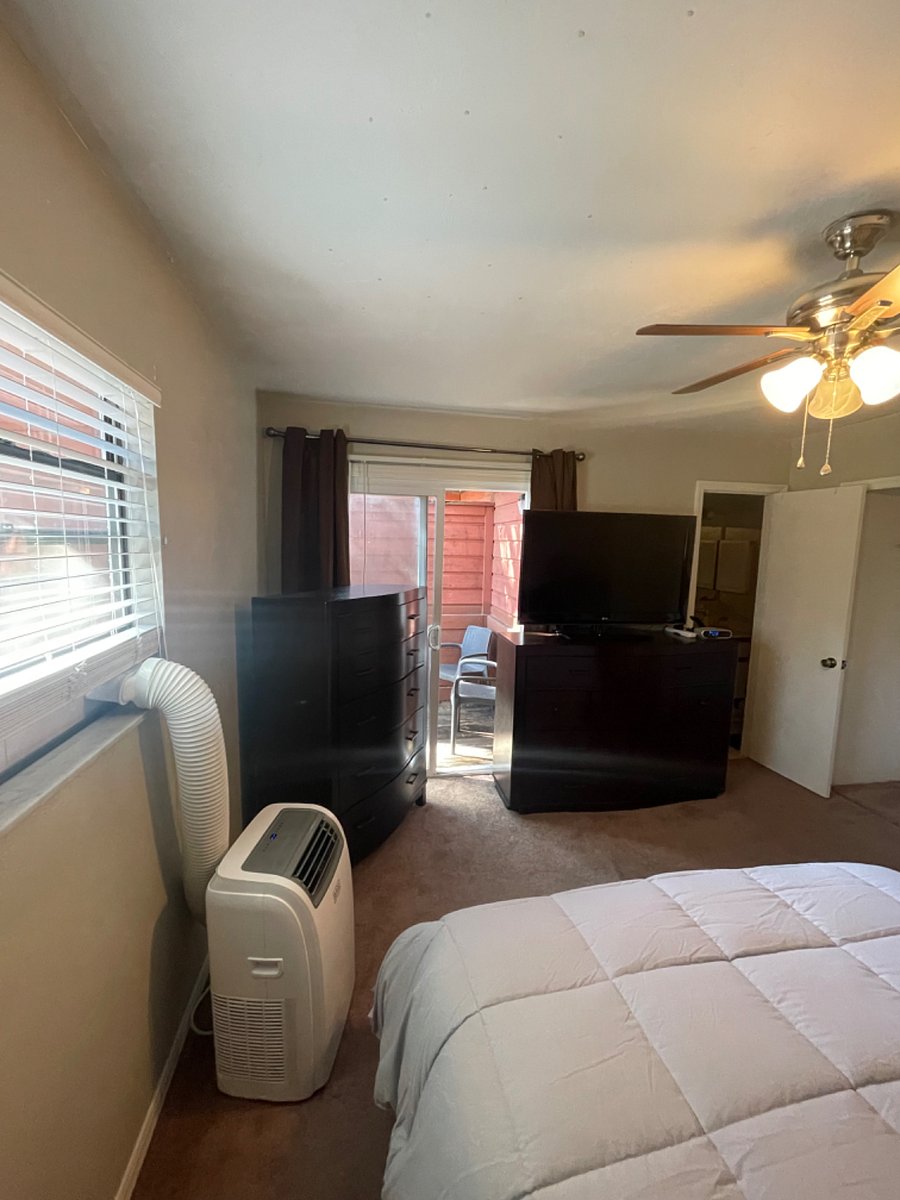 Portable A/C Unit & Deck in Master Bedroom