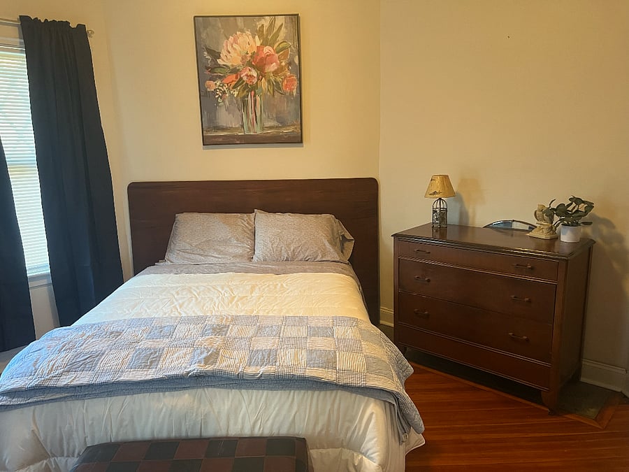 Bedroom with queen bed. Bright and sunny.