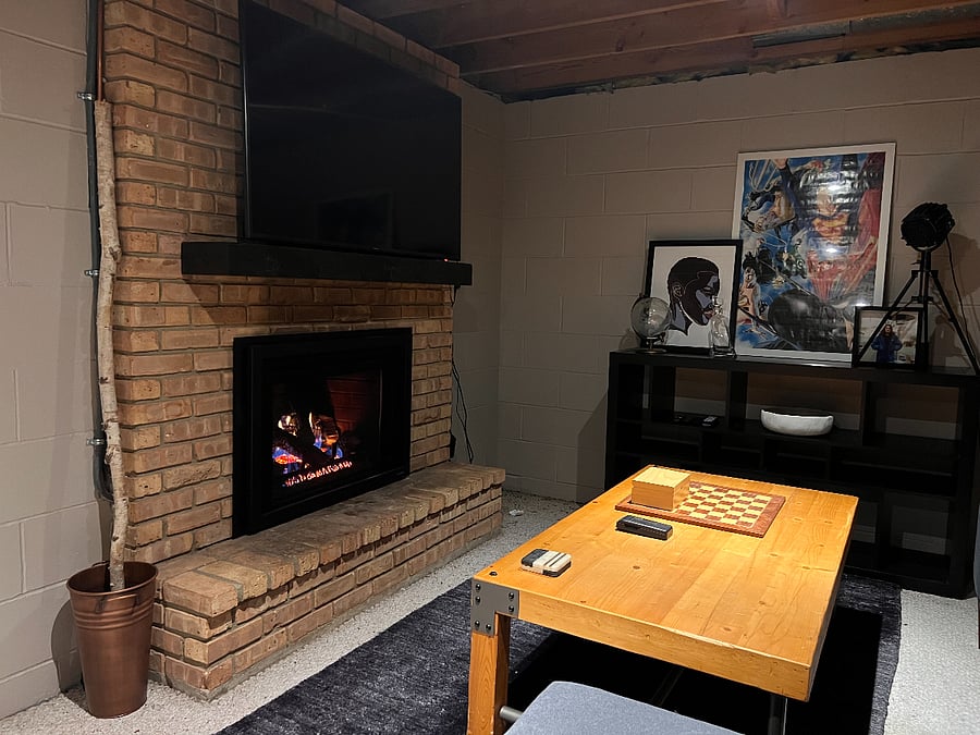 Semi-finished basement with an entertainment room with gas fireplace.