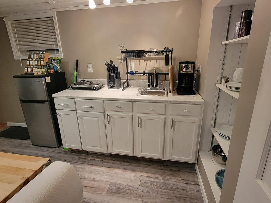 kitchenette with small sink although appliances and space for regular meal cooking and prep.