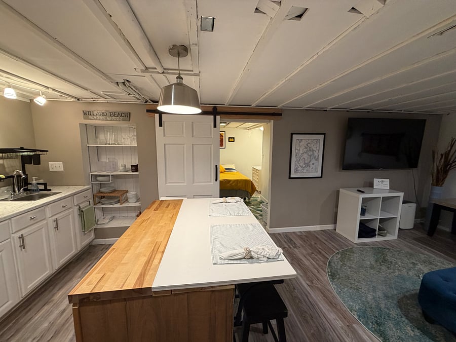 Entry to bedroom area with sliding barn door.