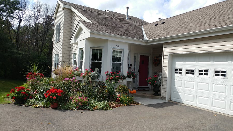 Front door, garage and Garden in summertime