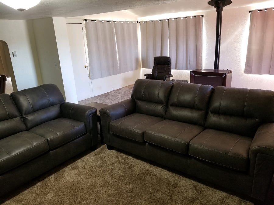 Large living room, brand new couch and loveseat.  Coffee table and  area rug coming soon! 