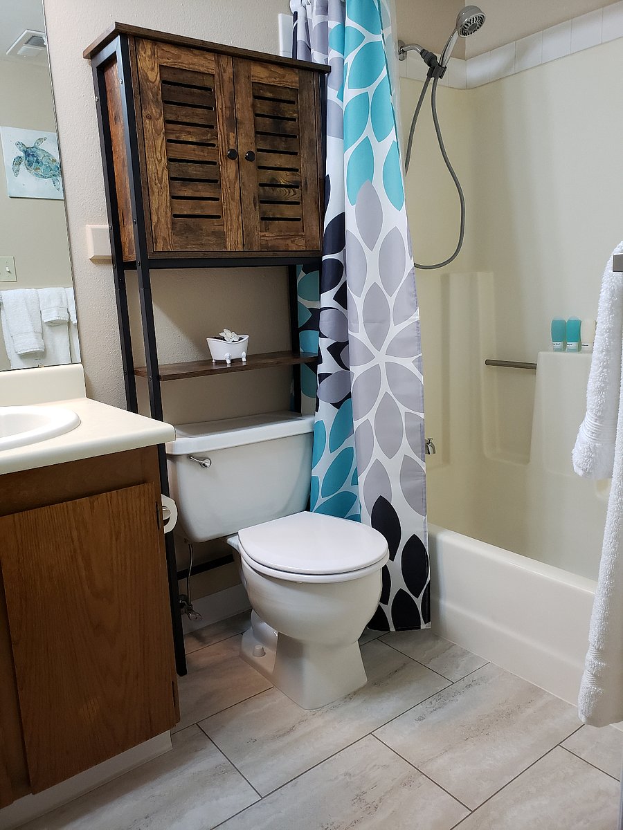 Full private bath with bathtub, Waterpik shower massage, towels, starter tp and toiletries