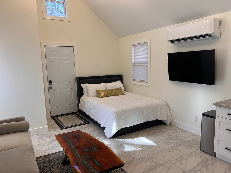 Queen bed with power and storage underneath.