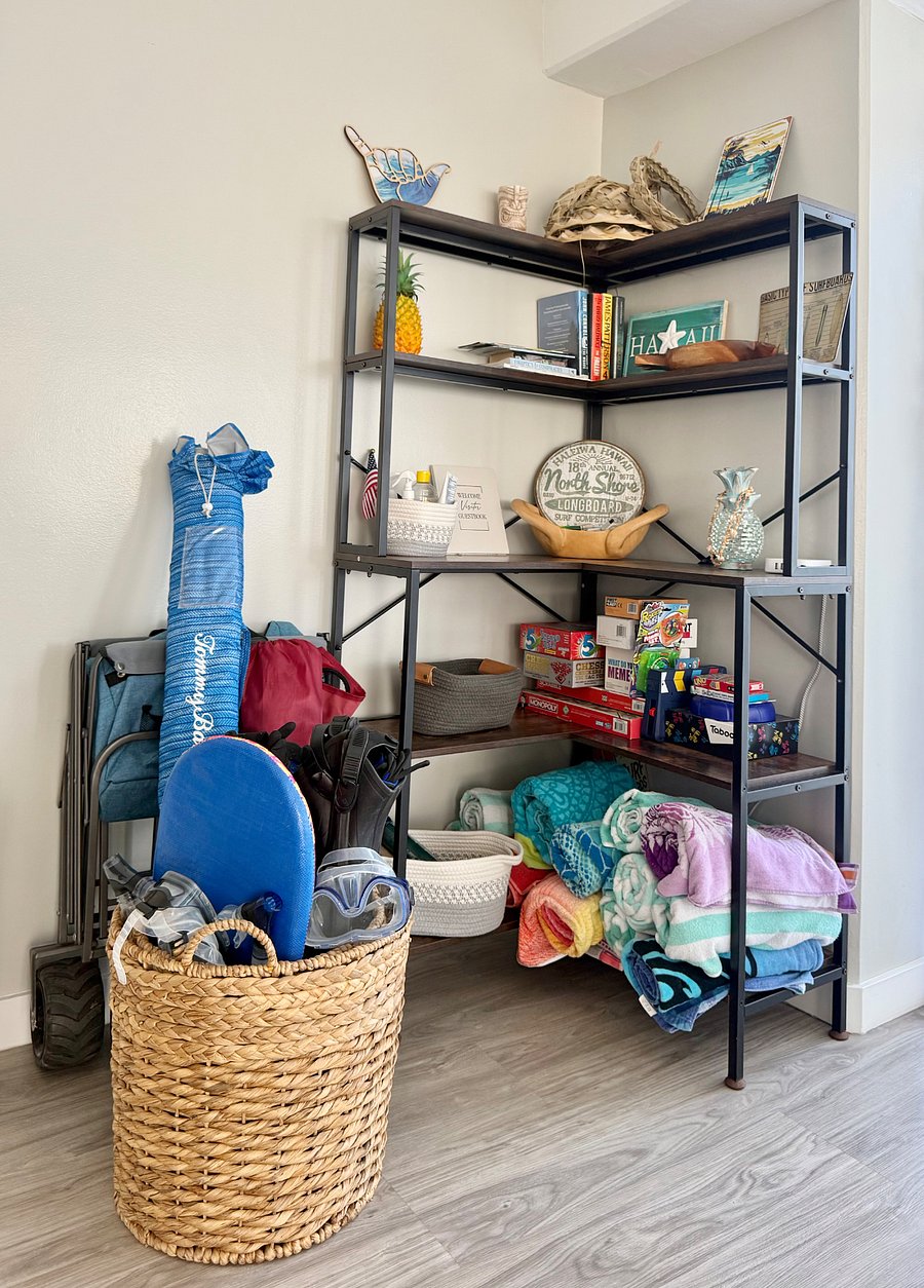 Shaka Corner with books, board games, and beach gear
