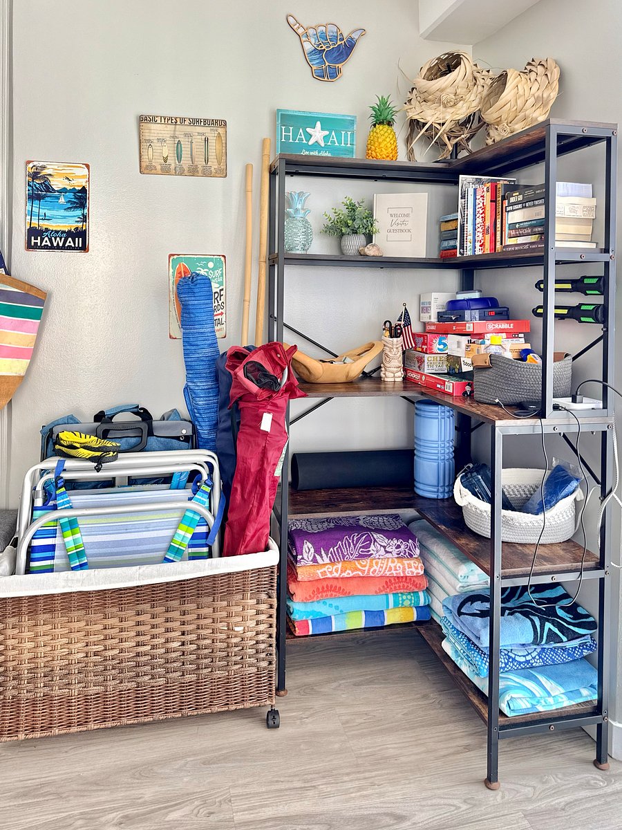 Nook with books, board games, yoga mats, and beach towels and chairs.