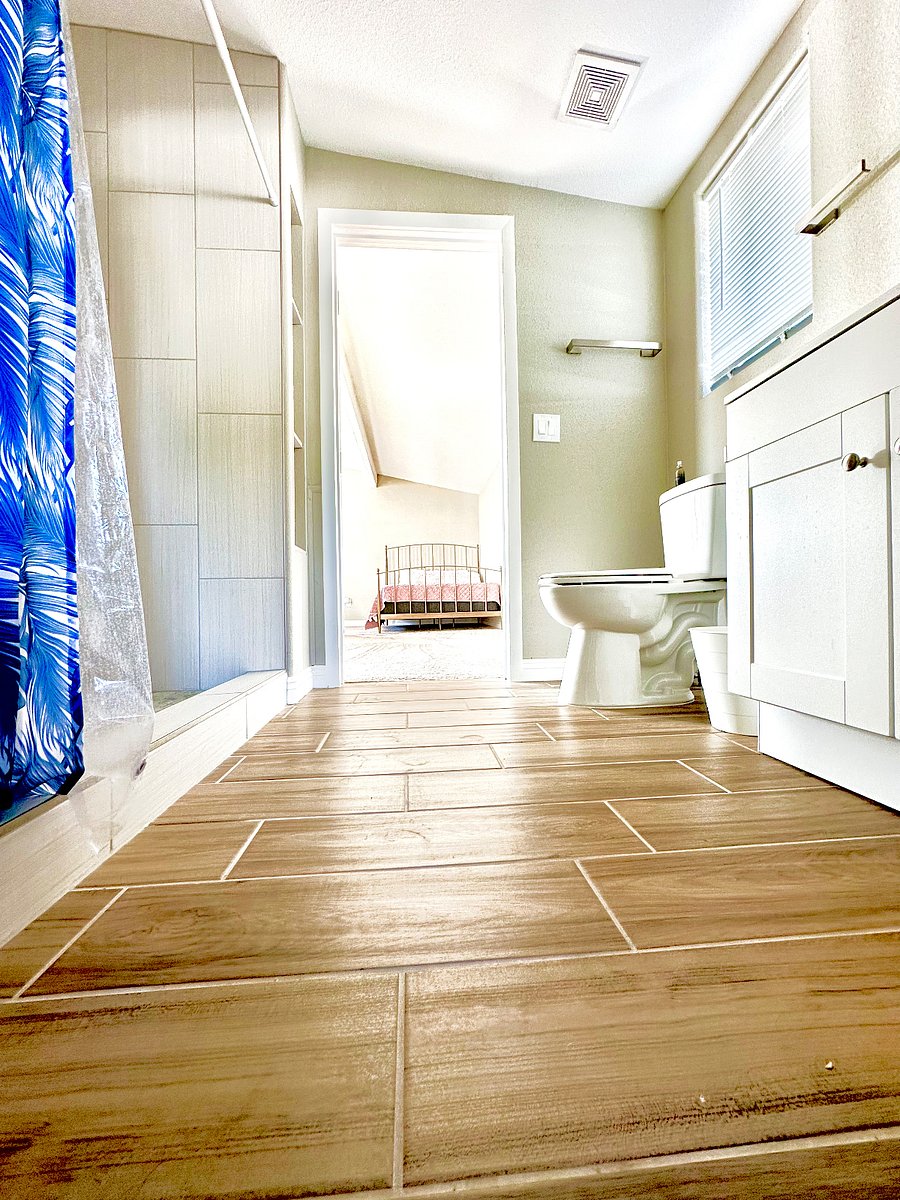Clean bathroom with warm rain shower.