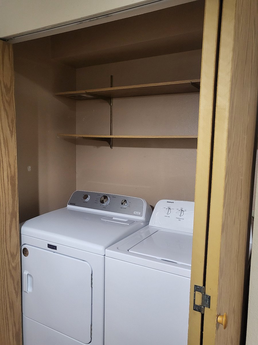 Oversized washer and dryer, with built-in pantry.
