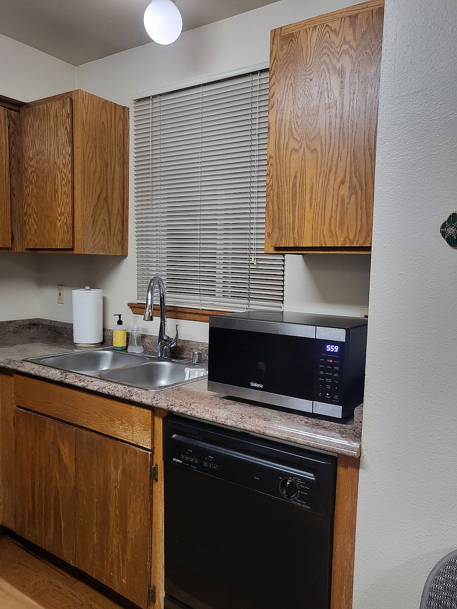Double sink with adjustable faucet.