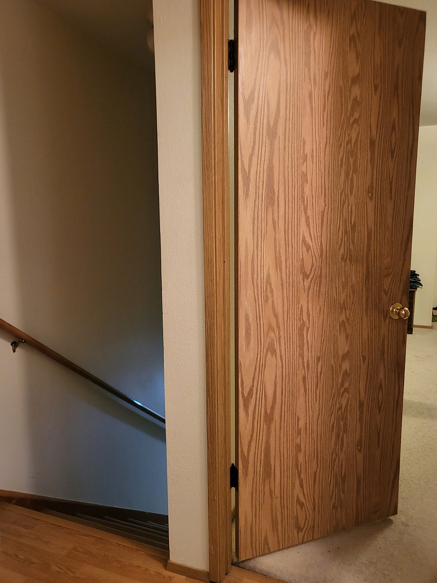 Hallway with view of stairs.