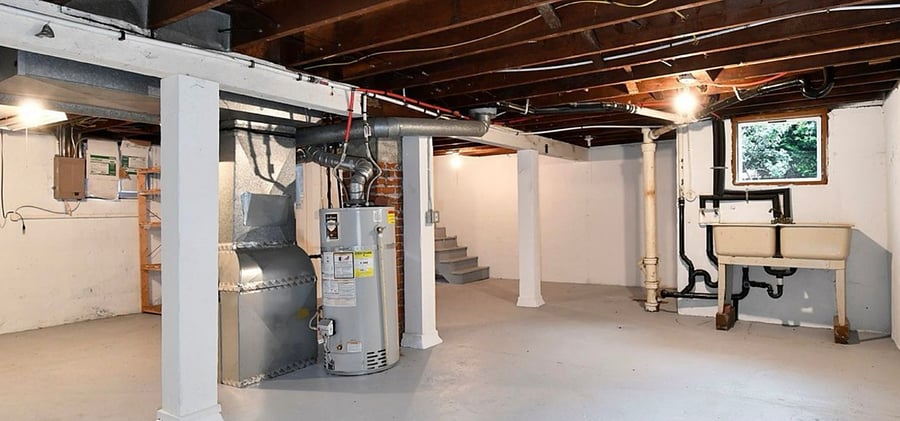 washer and dryer located in basement
