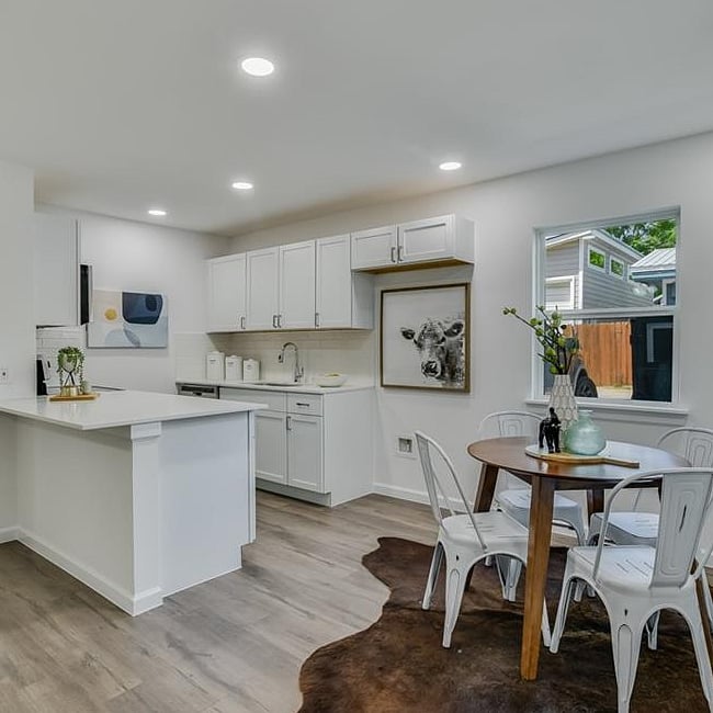 Spacious kitchen with new, full size fridge.