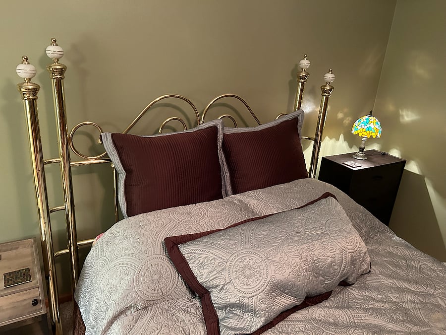 Close up of Queen Bed with Nightstands and drawers for your personal storage needs.