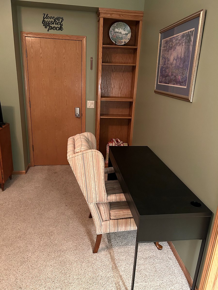 Desk with Comfortable Chair for Computer Use and built-in shelving to store your personal items.