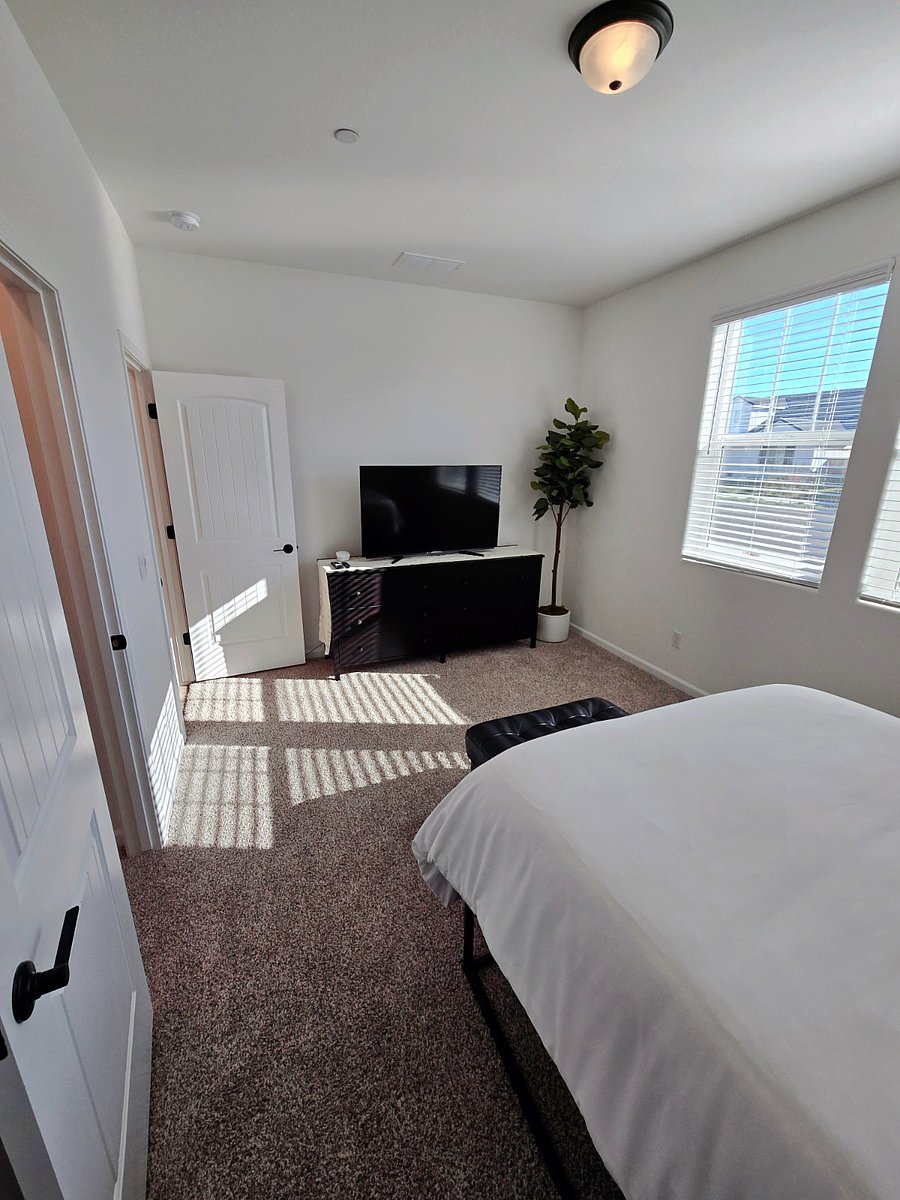 Private bedroom with full-sized bed, night lamp with USB charging ports, large night stand with storage, walk-in closet, ottoman, 6-drawer dresser, and 40-inch screen TV with firestick.