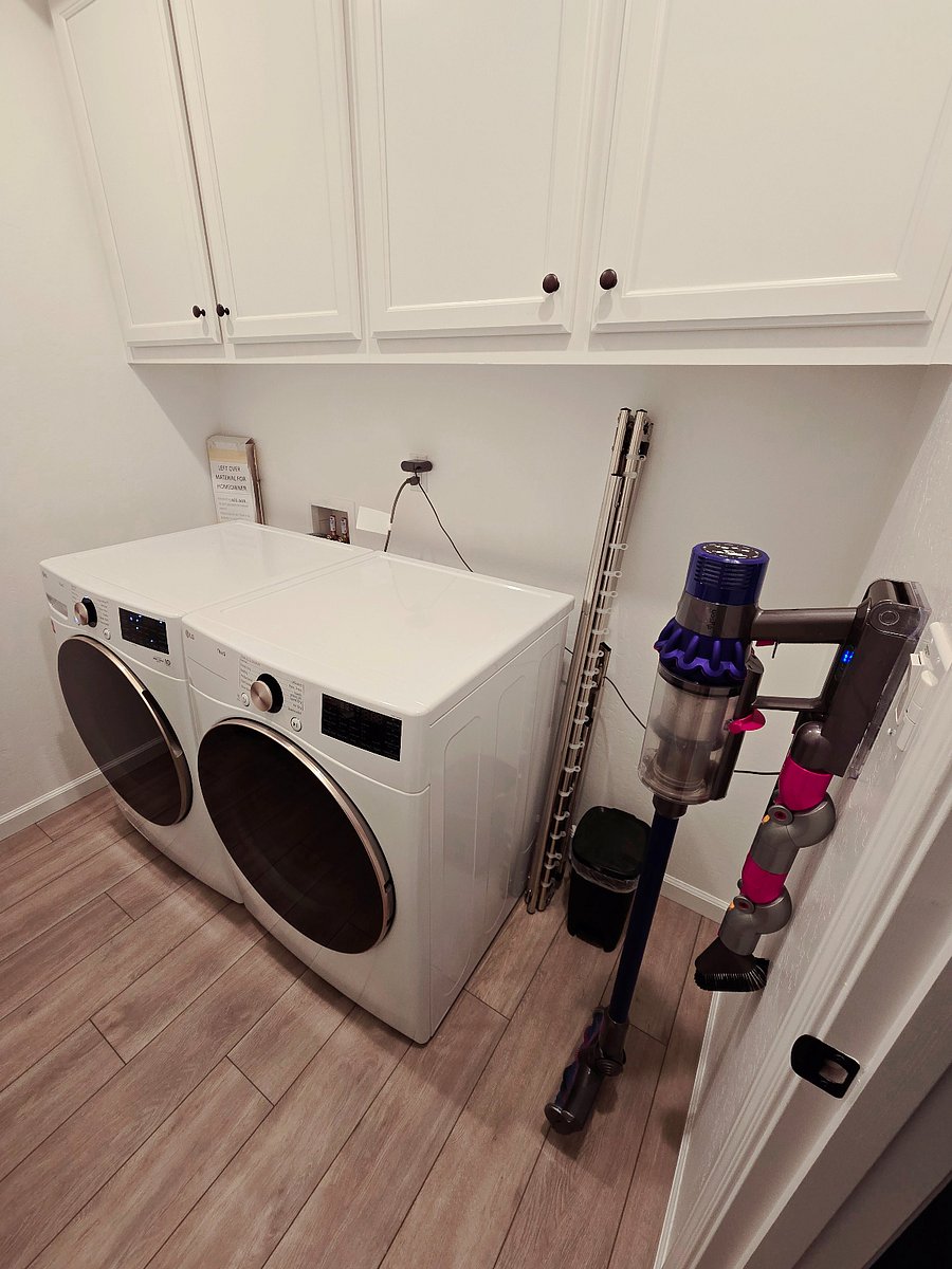In-home unit washer and dryer as well as Dyson vacuum.