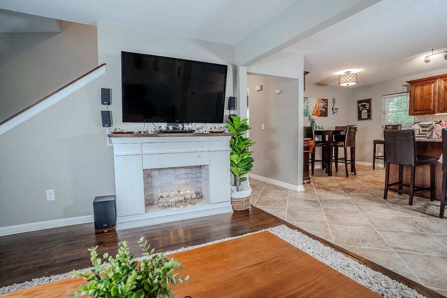 Living room with 55" TV and mantle