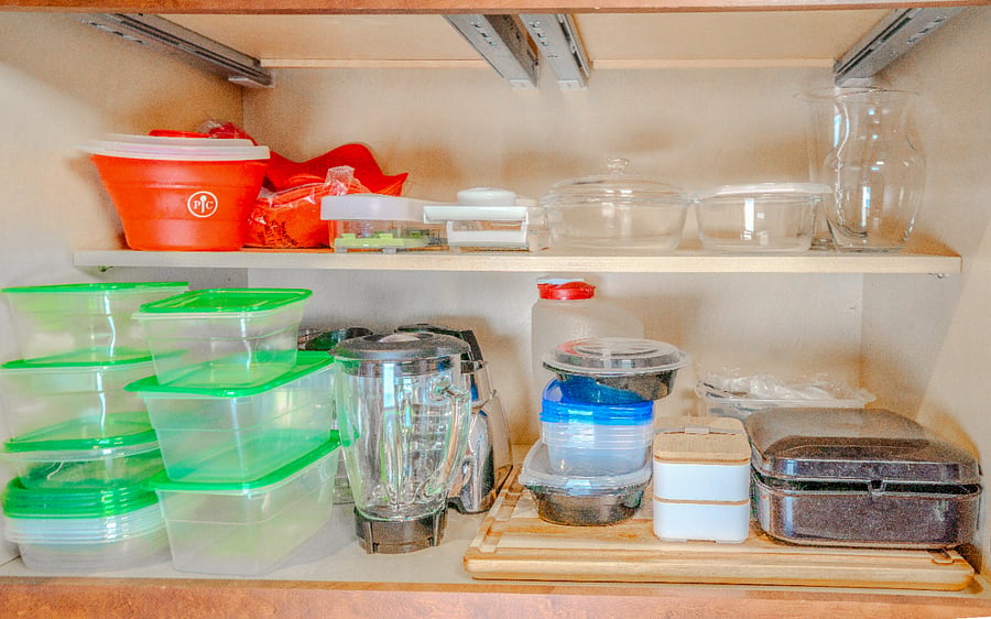 Tupperwares, blender, hand mixer, cutting board