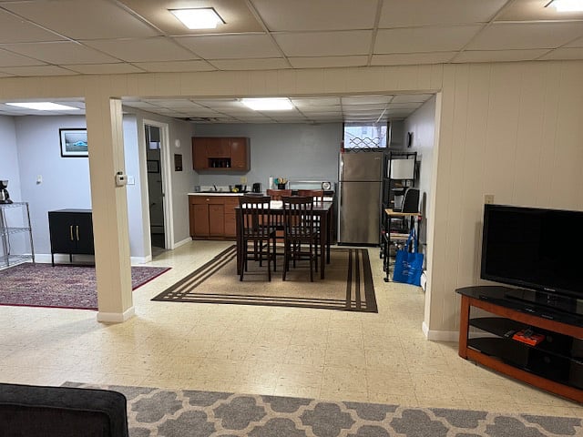 view of Kitchen and dining area (that wall is about 40 ft away), sun light peeks through the window)
