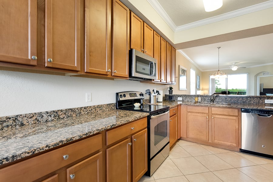 Kitchen area including stove and microwave.