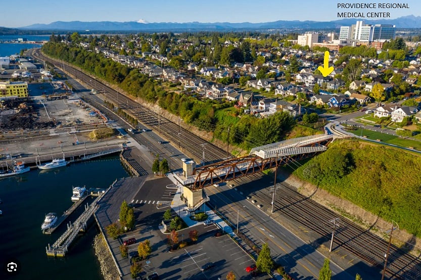 Yellow arrow is the house. You just have to walk down the alley 1 block and you are at the Grand Ave Park Bridge. You can also see how close it is to Providence Regional Medical (Colby Campus), Providence Cancer Center and Seattle Childrens Hospital North Campus.