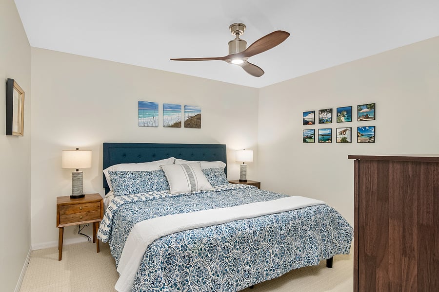 Guest King BR with side tables outfitted with USB ports and touch-activated lamps.