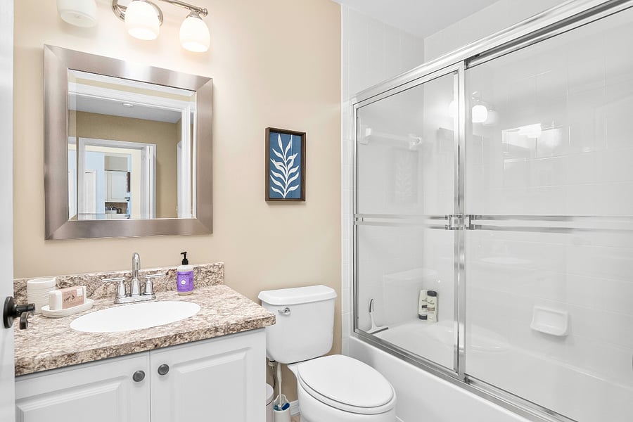 Guest bathroom with tub and shower.