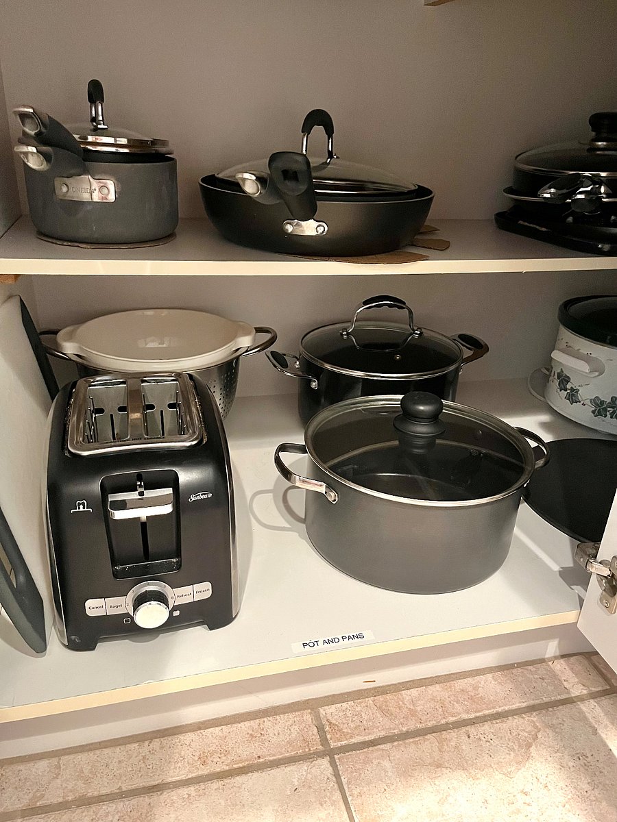 Plenty of pots and pans including a crock pot, drip coffee pot, Keurig coffee pot and tea kettle.  