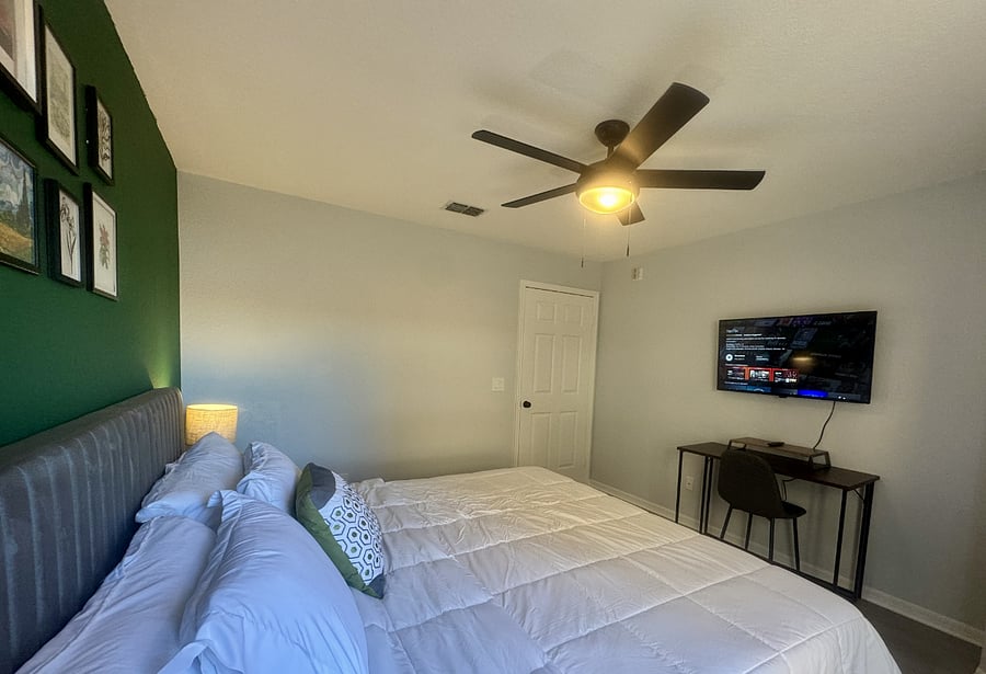 The king sized bed features a premium memory foam mattress, hotel quality sheets, and multiple pillow types. There is a 42" smart TV.