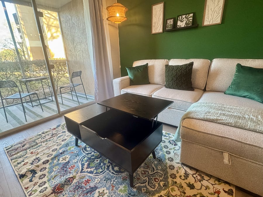 The coffee table has a top that pulls out and up creating a more convenient surface for snacking or working on a laptop.